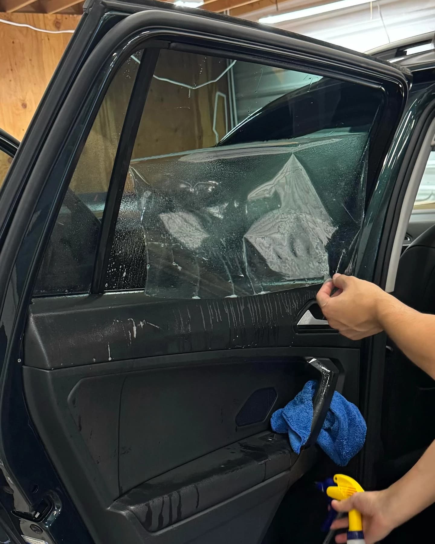tech applying automotive window tint